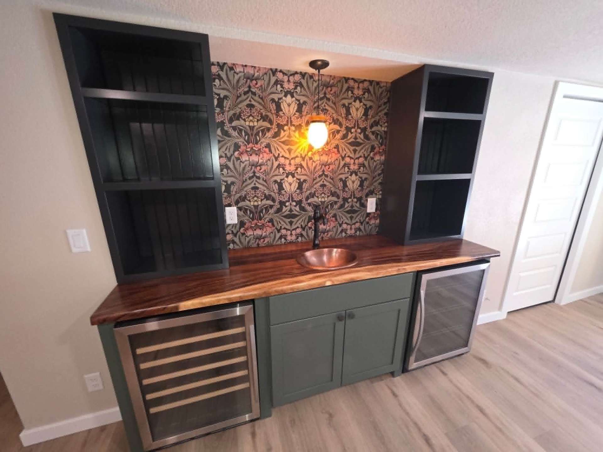 Custom built-in wet bar with live-edge walnut countertop and copper sink in Chelan WA by Garcia Home Renovations